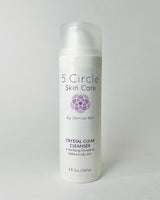 A pump bottle of Crystal Clear Cleanser by 5 Circle Skin Care, with product details and branding visible.